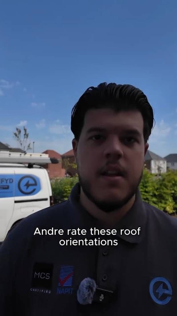 Andre on a driveway beside the Electrifyd van, talking to camera about roof orientations
