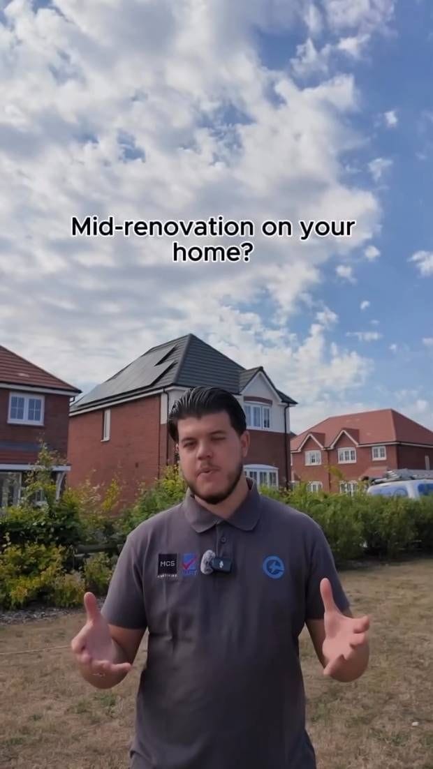 Andre on a new-build estate, talking to camera about fitting solar during a renovation